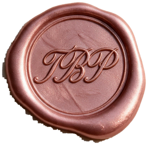 A rose-copper wax seal pressed with the monogram TBP